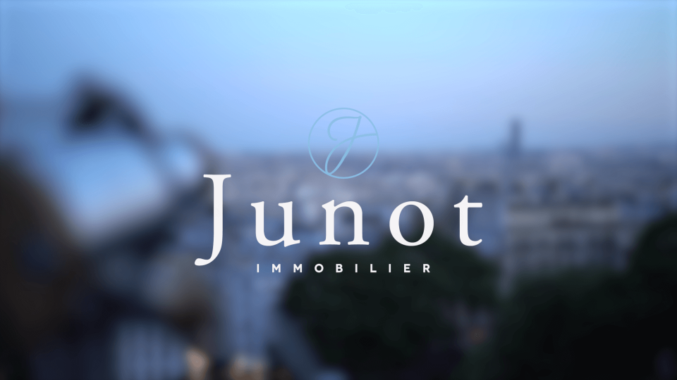 View of Junot logo and Paris in the background