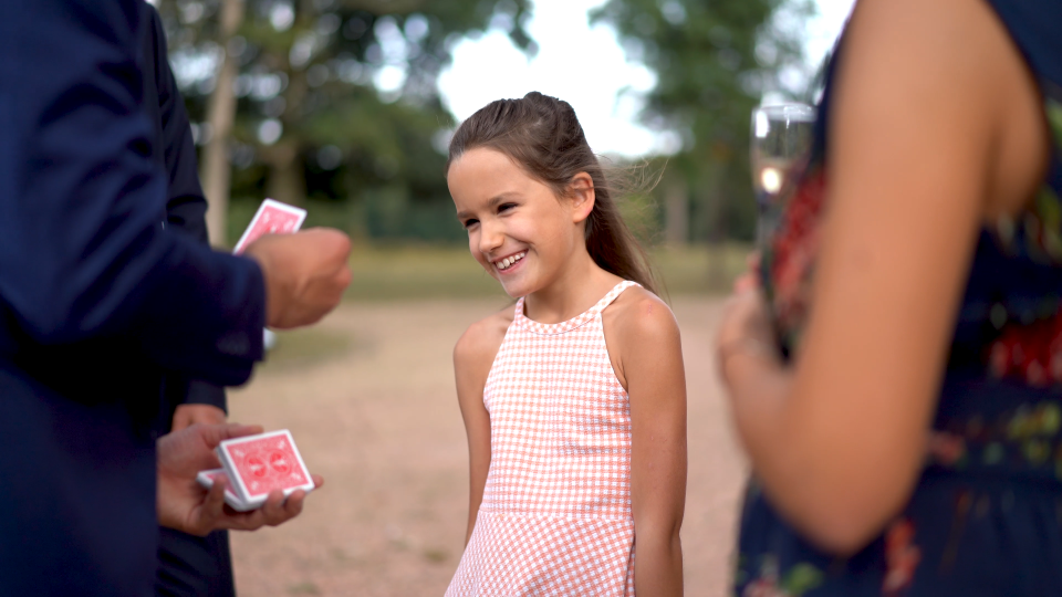 Kid amazed by magic trick