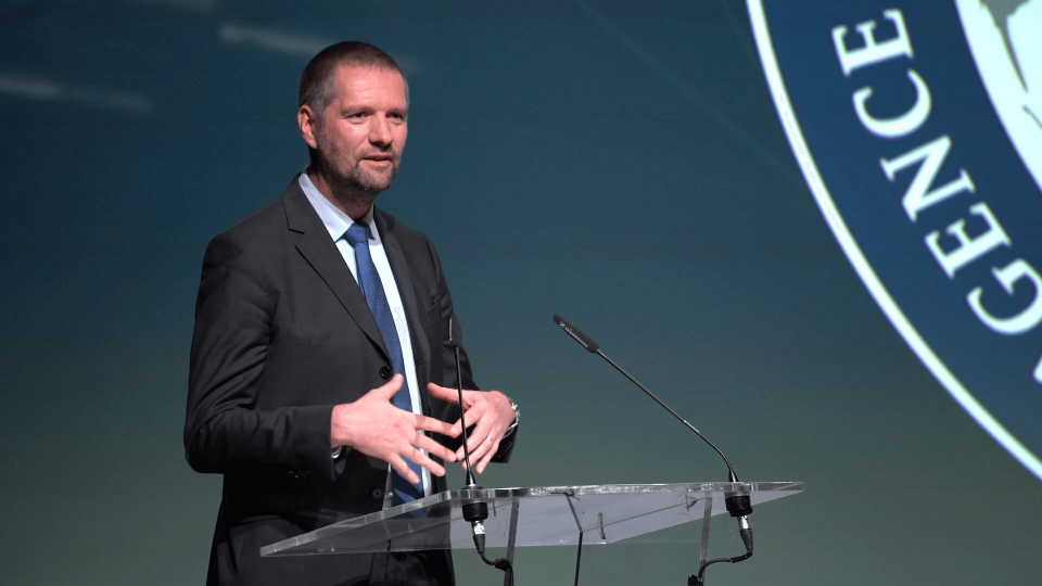 Presenter in front of attendees.