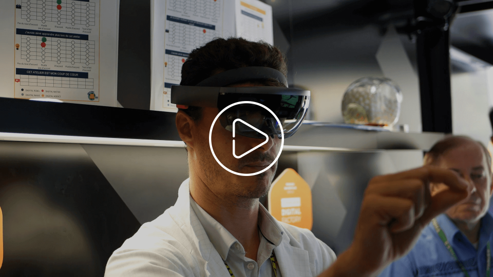 Thales staff experiencing mixed reality through a helmet