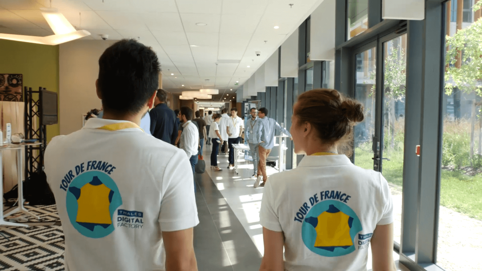 Two people walking with the camera behind them