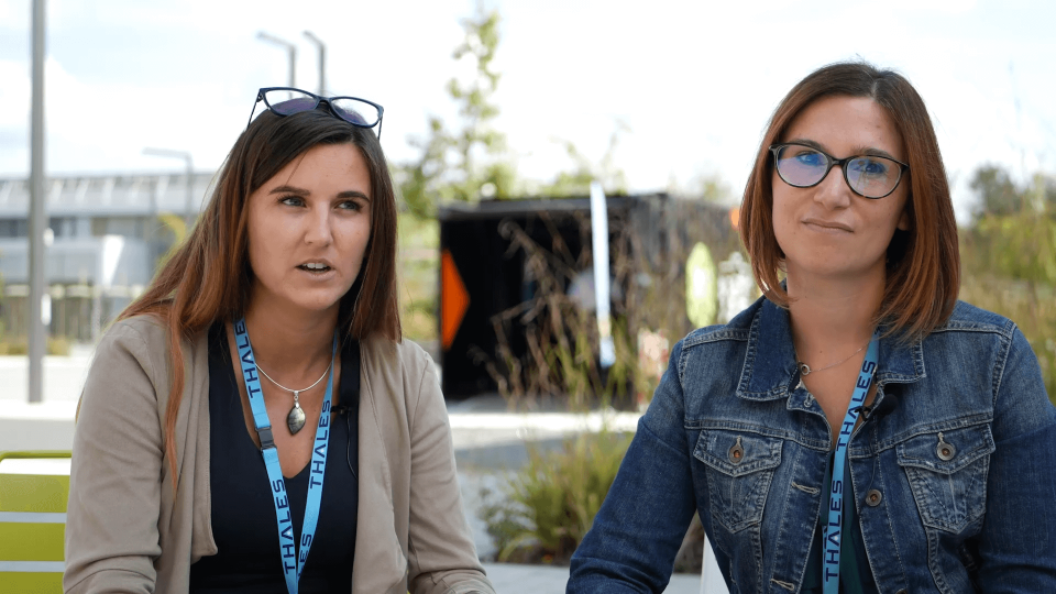 Two women talking to the camera